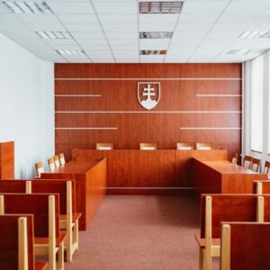 a room filled with wooden desks and chairs